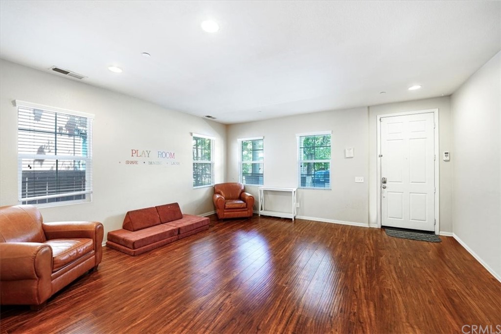 1777 Carrie Way Riverside, CA 92501 - Photo 21 of 35 a living room with furniture and a wooden floor