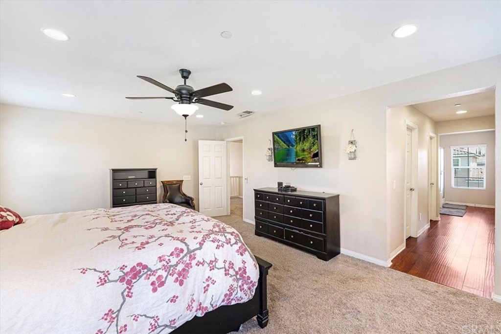 1777 Carrie Way Riverside, CA 92501 - Photo 27 of 35 a bedroom with a bed and a dresser