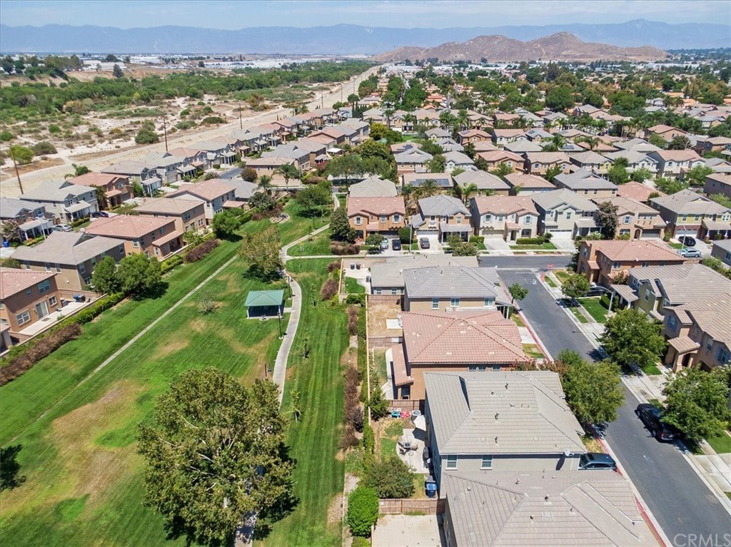1777 Carrie Way Riverside, CA 92501 - Photo 31 of 35 an aerial view of residential houses with outdoor space and trees