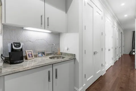 a bathroom with a sink a mirror and a bathtub
