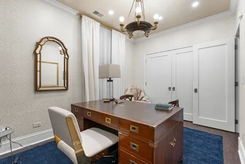 a utility room with a sink and cabinets