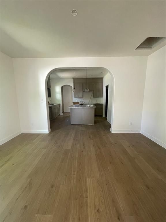 608 Ritchey Street Gainesville, TX 76240 - Photo 3 of 10 a view of a living room with a wooden floor