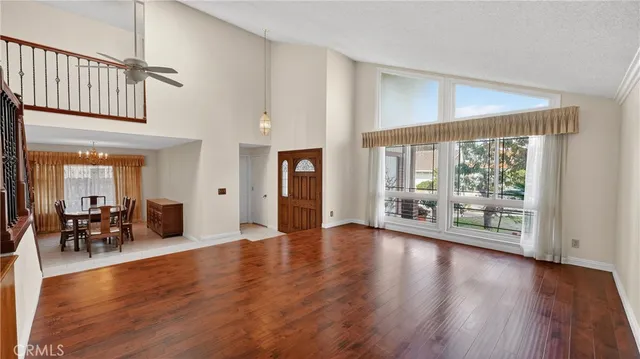 an aerial view of residential houses with yard