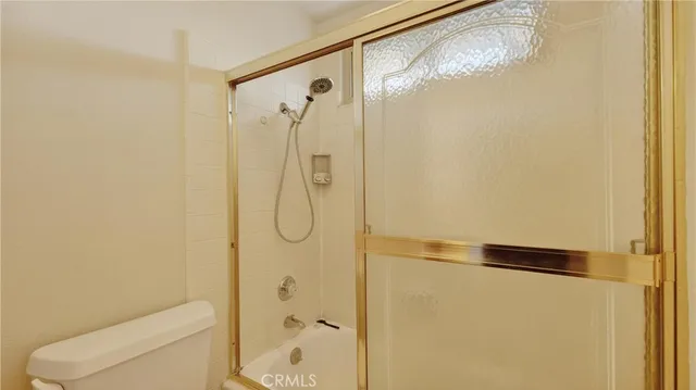 a bathroom with a granite countertop sink and mirror