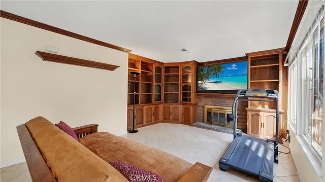 a bedroom with furniture and wooden floor