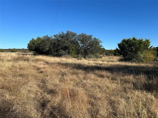 a view of lake with green space
