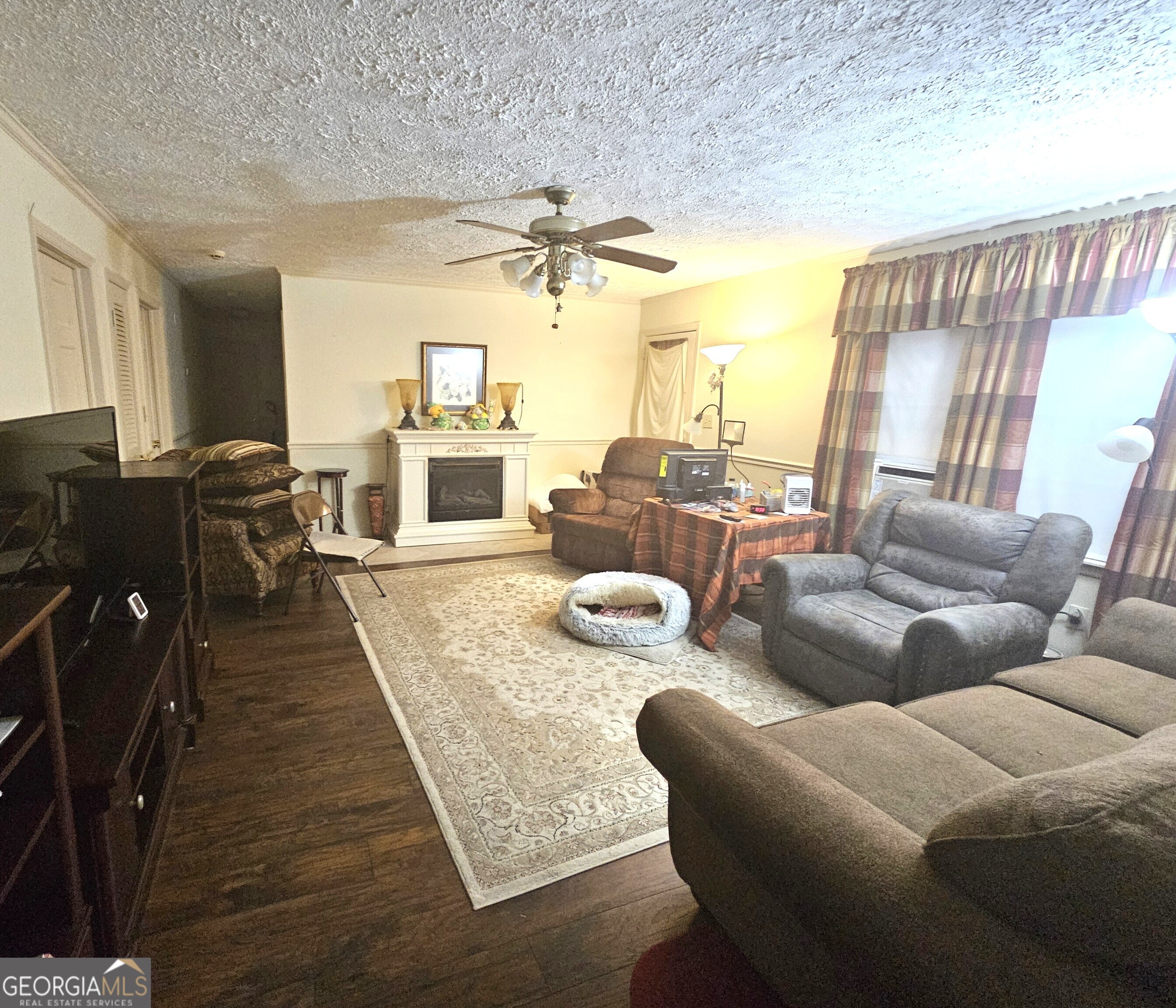 613 Old Macon Road Dublin, GA 31021 - Photo 4 of 17 a living room with furniture and a fireplace