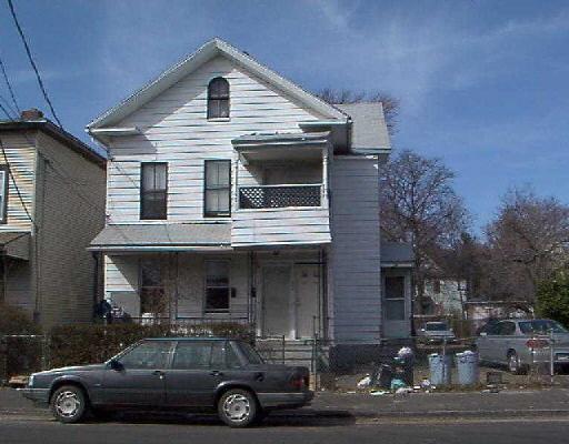 597 Ogden Street Bridgeport, CT 06608 - Photo 1 of 1 a car parked in front of a house