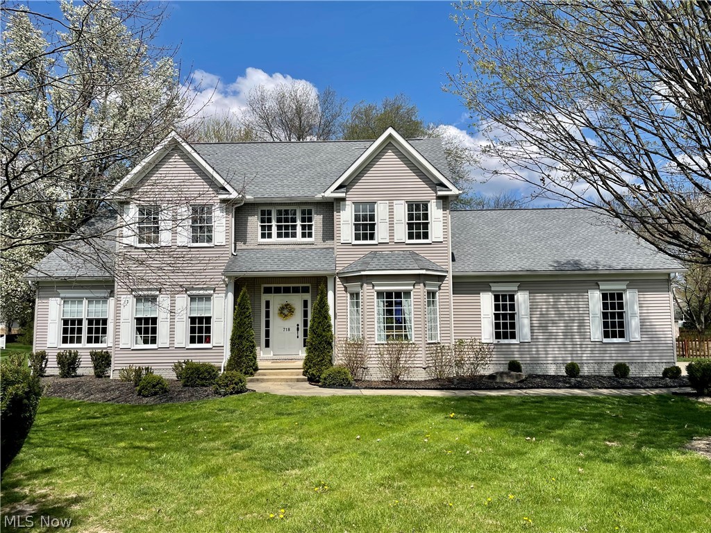 View of property featuring a front yard