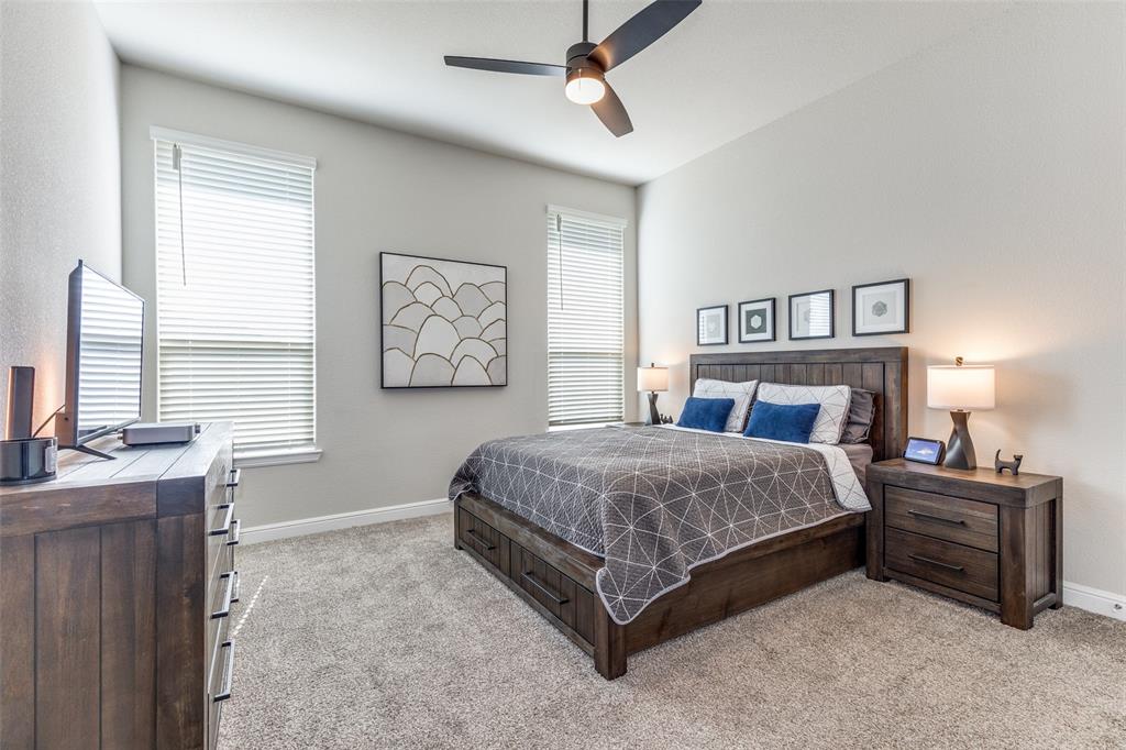 1829 Bellatrix Drive Haslet, TX 76052 - Photo 14 of 25 a bedroom with a bed and a table