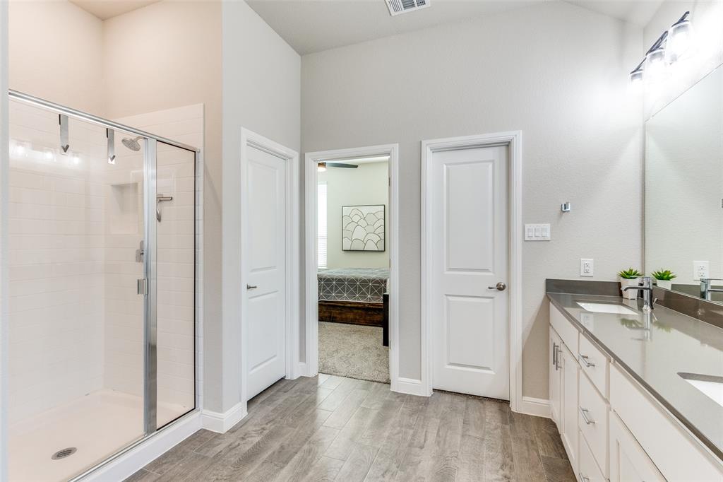 1829 Bellatrix Drive Haslet, TX 76052 - Photo 15 of 25 a bathroom with a double vanity sink and mirror