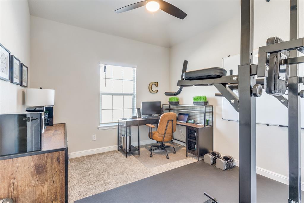 1829 Bellatrix Drive Haslet, TX 76052 - Photo 17 of 25 a view of a workspace with furniture and a window