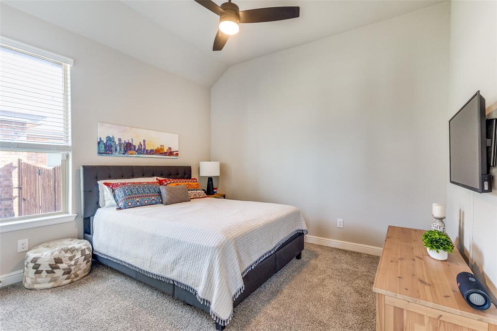 1829 Bellatrix Drive Haslet, TX 76052 - Photo 20 of 25 a bedroom with a bed and a window