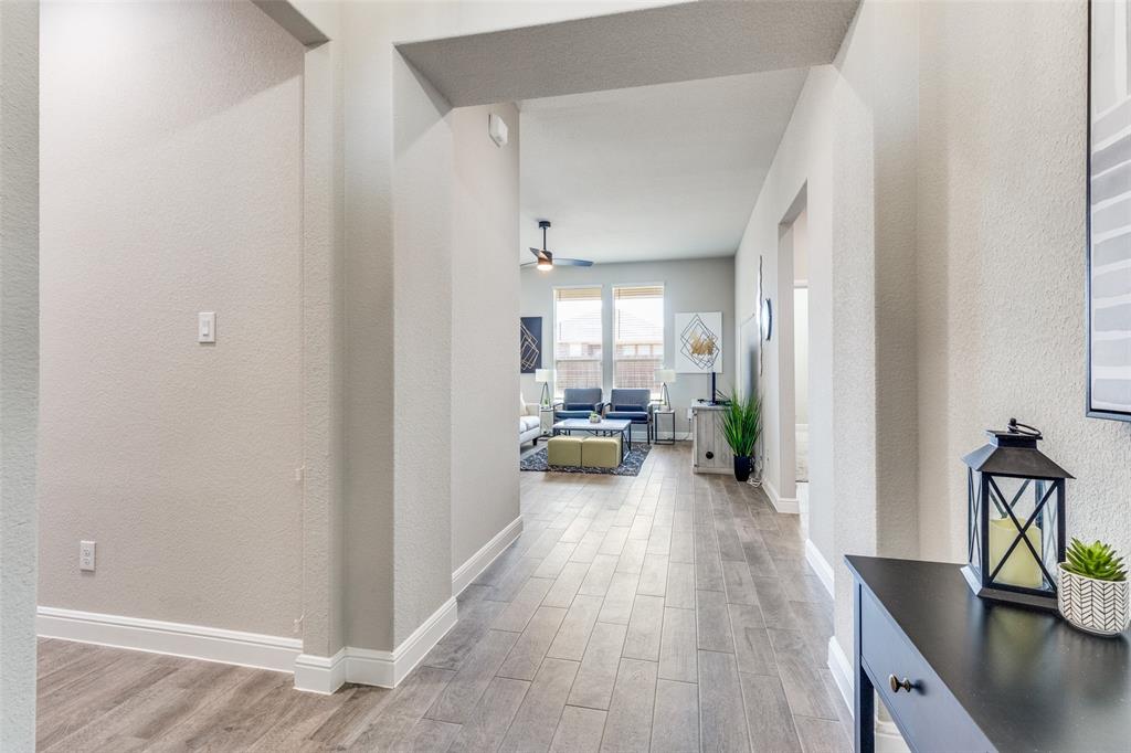 1829 Bellatrix Drive Haslet, TX 76052 - Photo 4 of 25 a view of a hallway with a livingroom and furniture