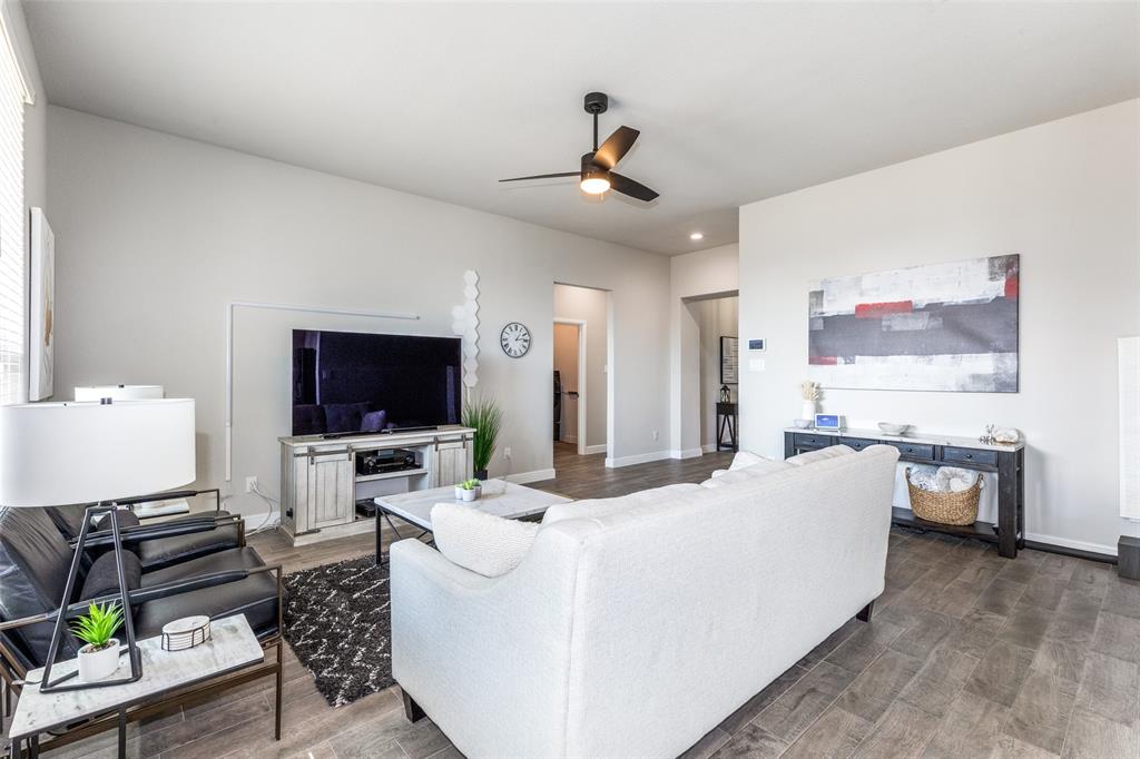 1829 Bellatrix Drive Haslet, TX 76052 - Photo 6 of 25 a living room with furniture and a flat screen tv