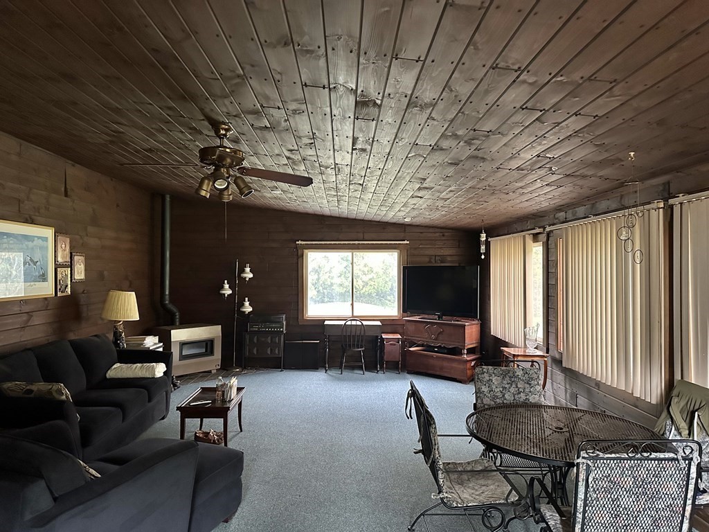 18 Seminole Road Dartmouth, MA 02748 - Photo 13 of 13 a living room with furniture and a flat screen tv
