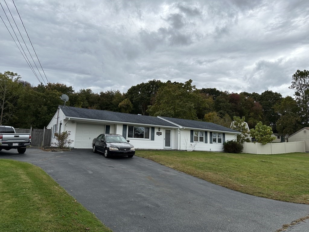 18 Seminole Road Dartmouth, MA 02748 - Photo 2 of 13 a view of a house with a big yard and sitting area
