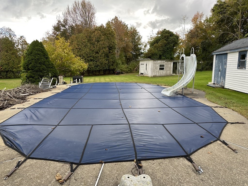 18 Seminole Road Dartmouth, MA 02748 - Photo 5 of 13 a view of a backyard with swimming pool
