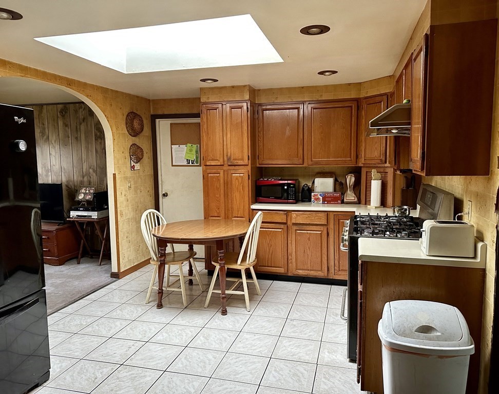18 Seminole Road Dartmouth, MA 02748 - Photo 6 of 13 a kitchen with a sink a stove and chairs