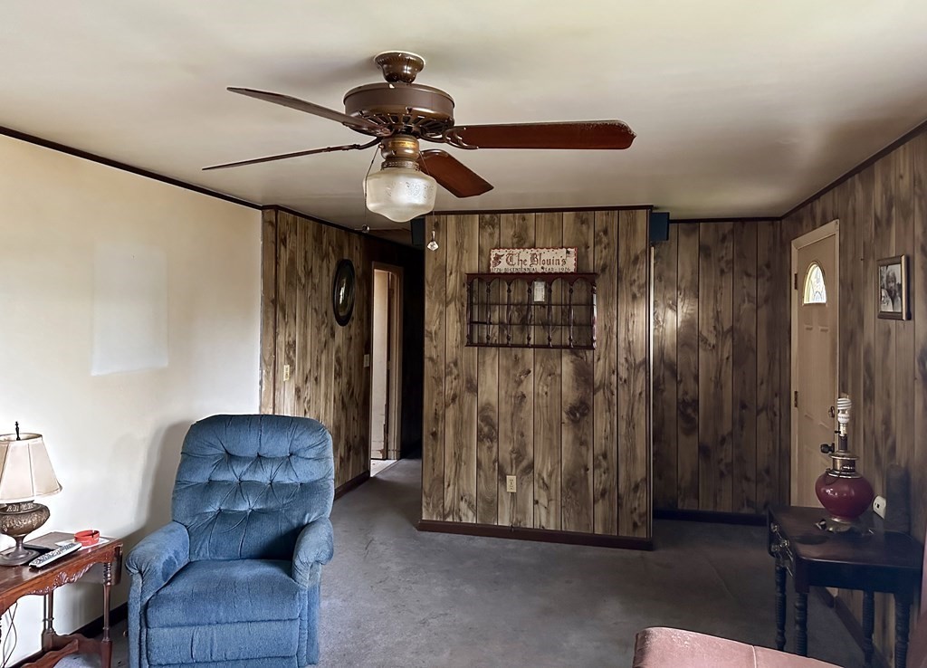 18 Seminole Road Dartmouth, MA 02748 - Photo 10 of 13 a living room with furniture and a chandelier