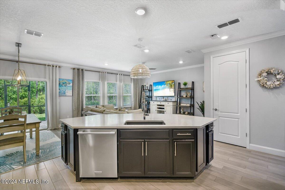 262 Clifton Bay Loop St. Johns, FL 32259 - Photo 13 of 57 a kitchen with a sink and a stove top oven