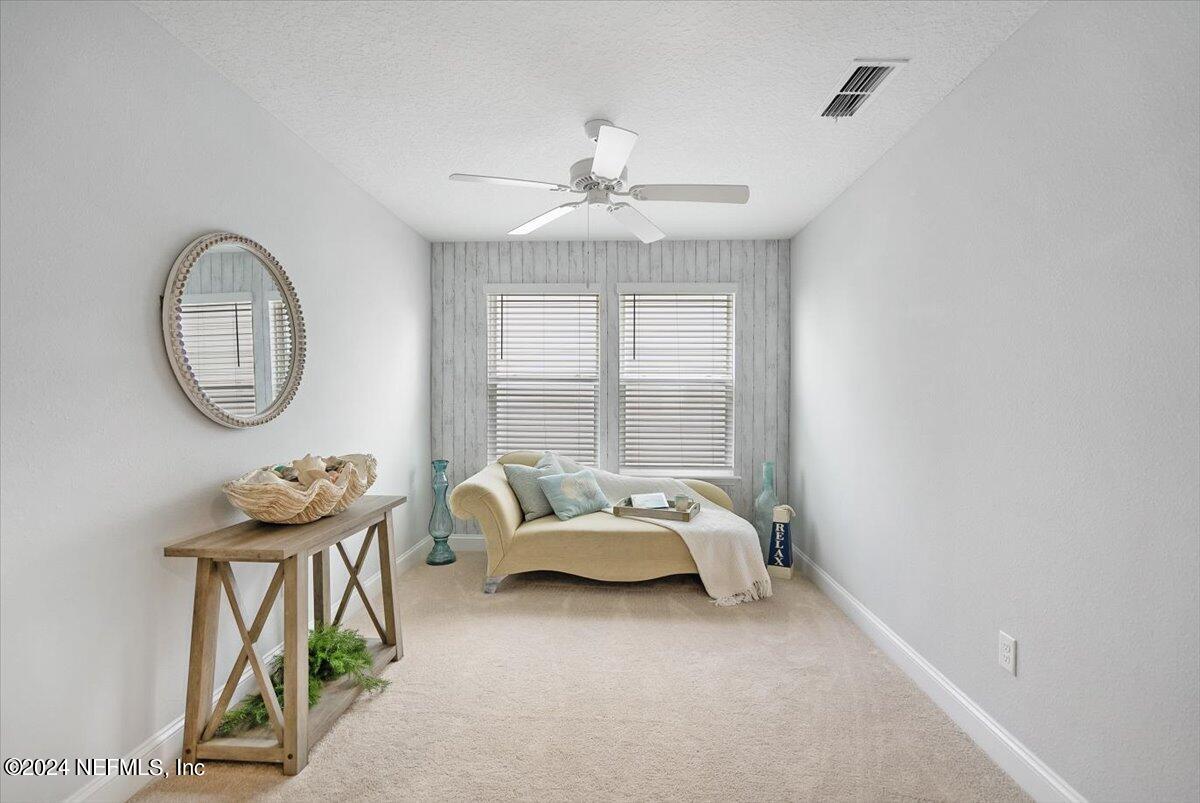 262 Clifton Bay Loop St. Johns, FL 32259 - Photo 17 of 57 a bedroom with furniture and a mirror