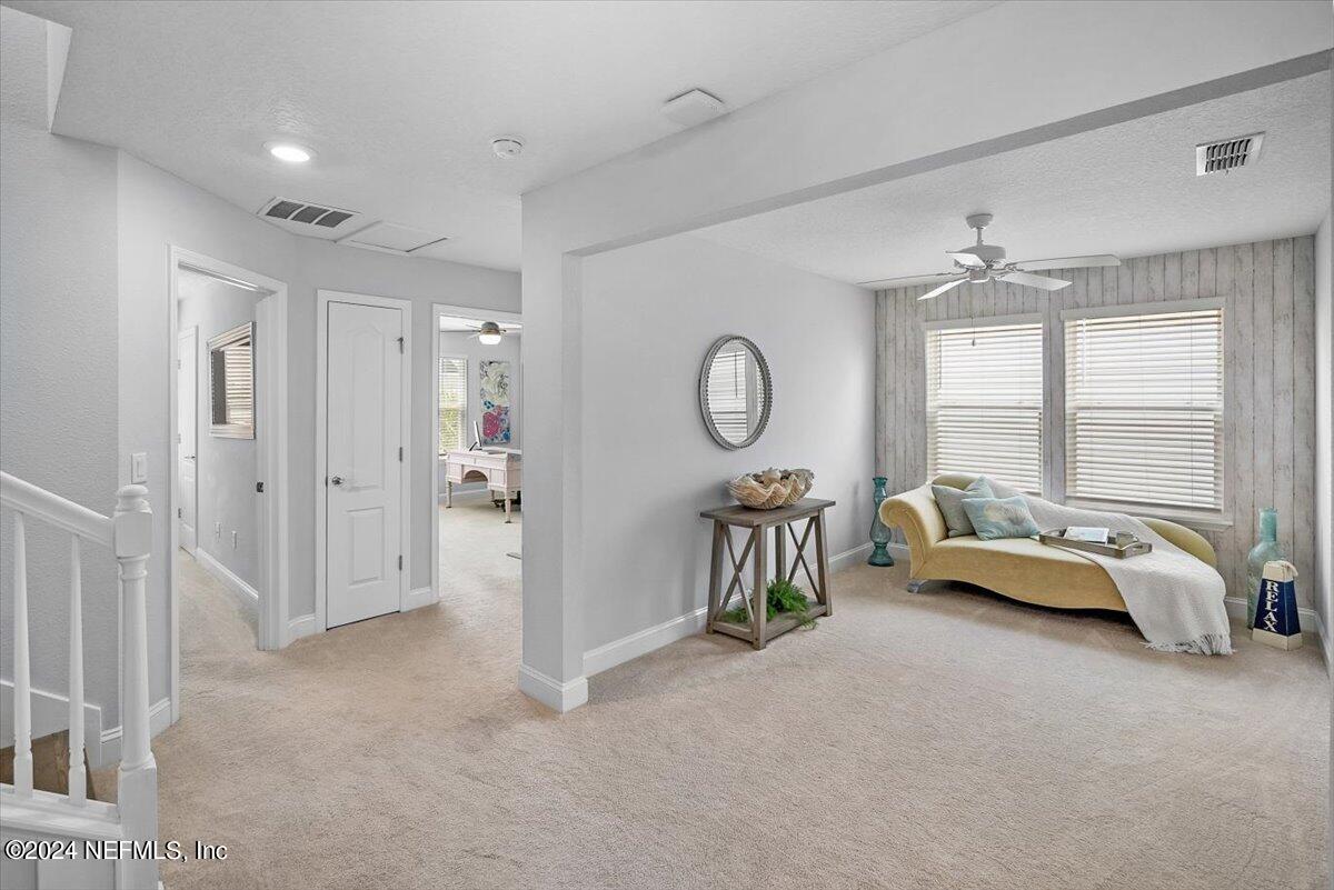 262 Clifton Bay Loop St. Johns, FL 32259 - Photo 18 of 57 a living room with furniture and a large window