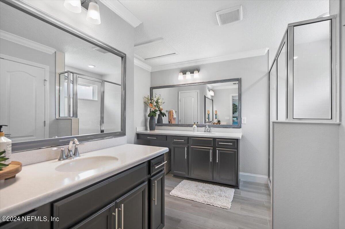 262 Clifton Bay Loop St. Johns, FL 32259 - Photo 21 of 57 a bathroom with a granite countertop sink and a mirror