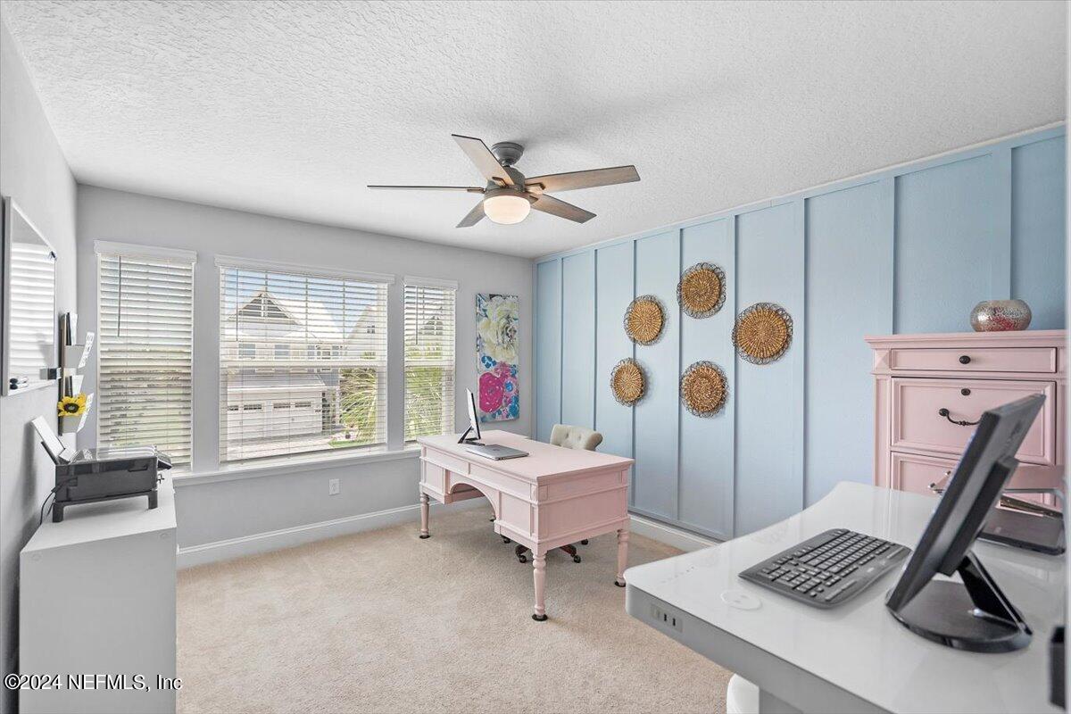 262 Clifton Bay Loop St. Johns, FL 32259 - Photo 26 of 57 a living room with furniture and a large window