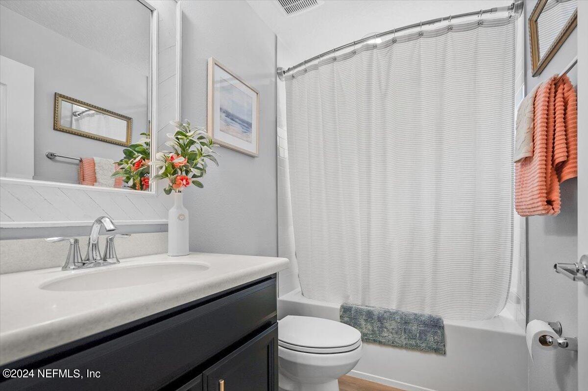 262 Clifton Bay Loop St. Johns, FL 32259 - Photo 27 of 57 a bathroom with a sink a toilet and a mirror