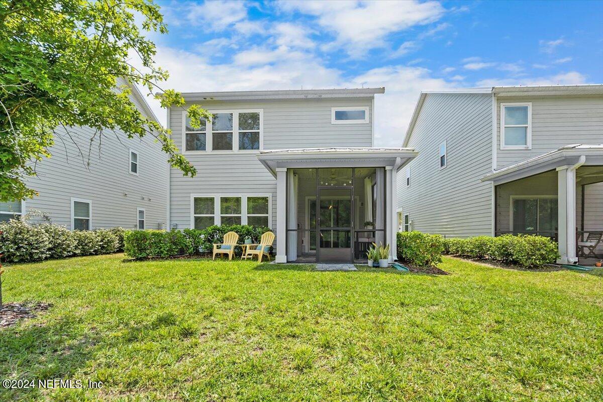 262 Clifton Bay Loop St. Johns, FL 32259 - Photo 32 of 57 a view of a house with a yard and sitting area