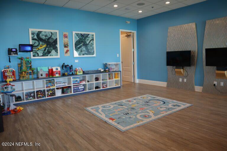 262 Clifton Bay Loop St. Johns, FL 32259 - Photo 57 of 57 a living room with furniture and a flat screen tv