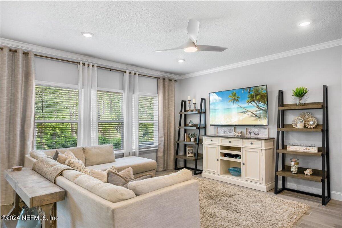 262 Clifton Bay Loop St. Johns, FL 32259 - Photo 7 of 57 a living room with furniture and a flat screen tv