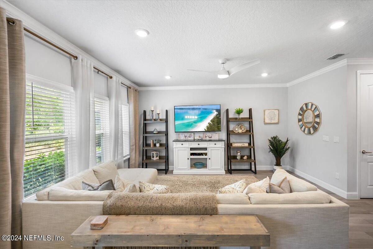 262 Clifton Bay Loop St. Johns, FL 32259 - Photo 8 of 57 a living room with furniture and a flat screen tv