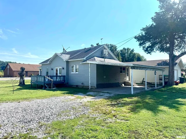 a house view with a sitting space and garden