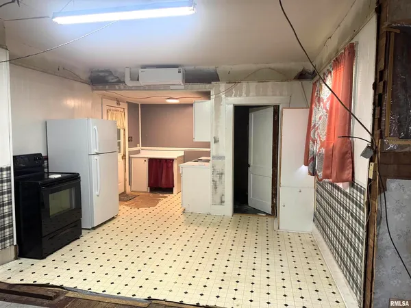 a view of a kitchen with a sink and dishwasher