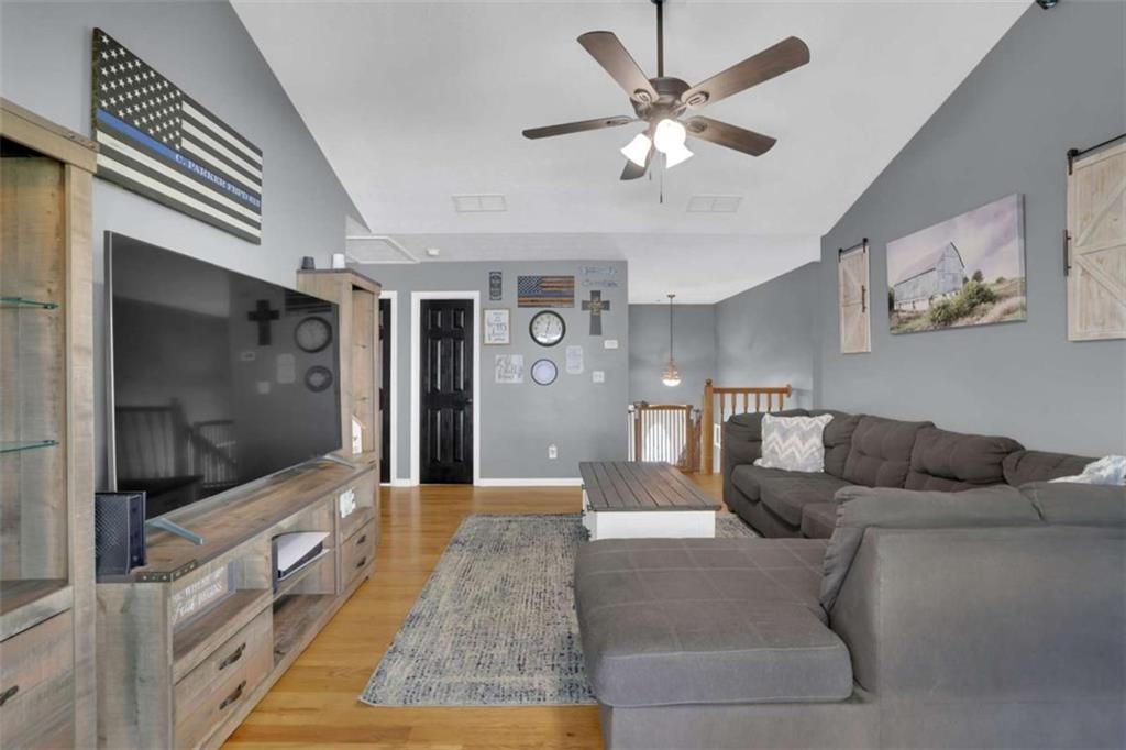 2932 Lake Hollow Road Gainesville, GA 30501 - Photo 12 of 68 a living room with furniture and a flat screen tv