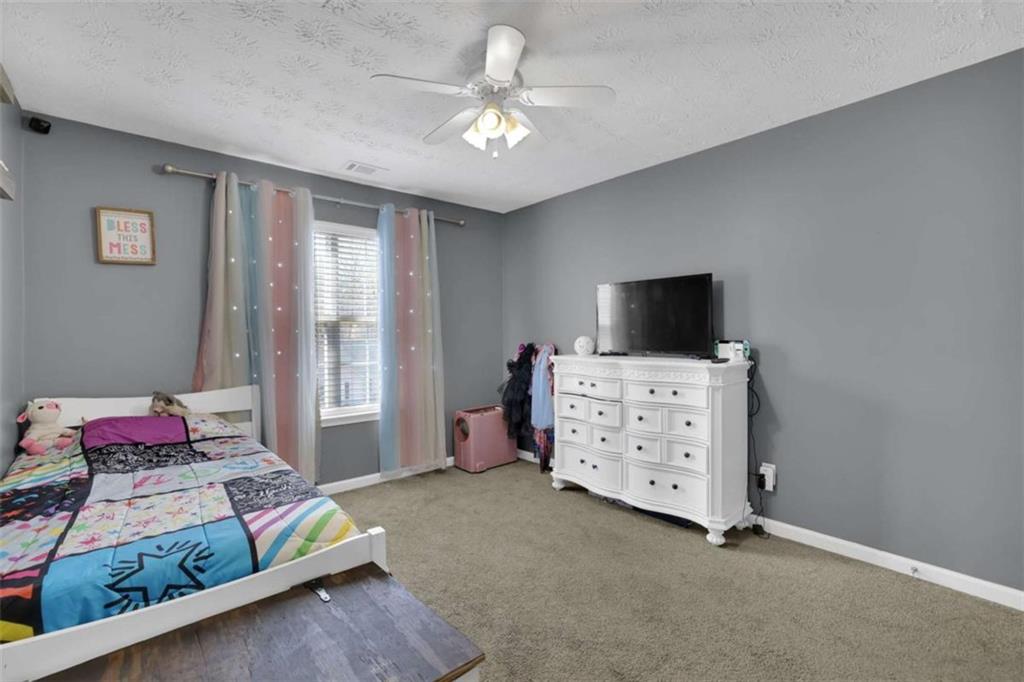 2932 Lake Hollow Road Gainesville, GA 30501 - Photo 15 of 68 a living room with furniture and a flat screen tv