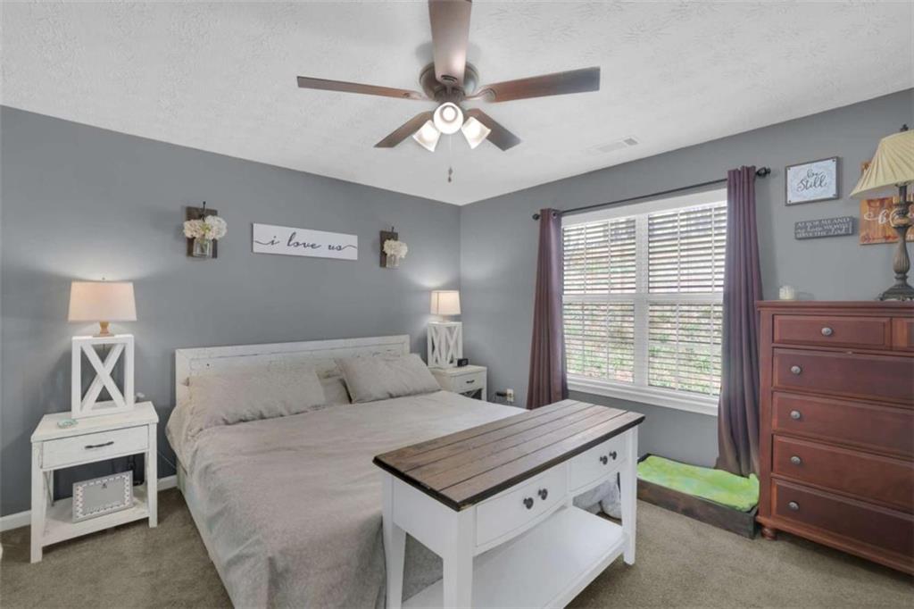 2932 Lake Hollow Road Gainesville, GA 30501 - Photo 30 of 68 a bedroom with a bed and a window