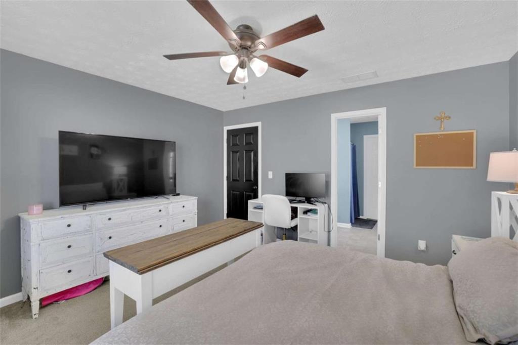 2932 Lake Hollow Road Gainesville, GA 30501 - Photo 32 of 68 a living room with furniture and a flat screen tv