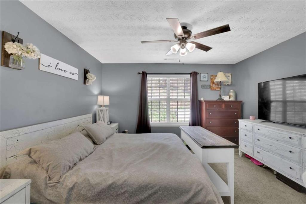 2932 Lake Hollow Road Gainesville, GA 30501 - Photo 34 of 68 a bedroom with a bed and window