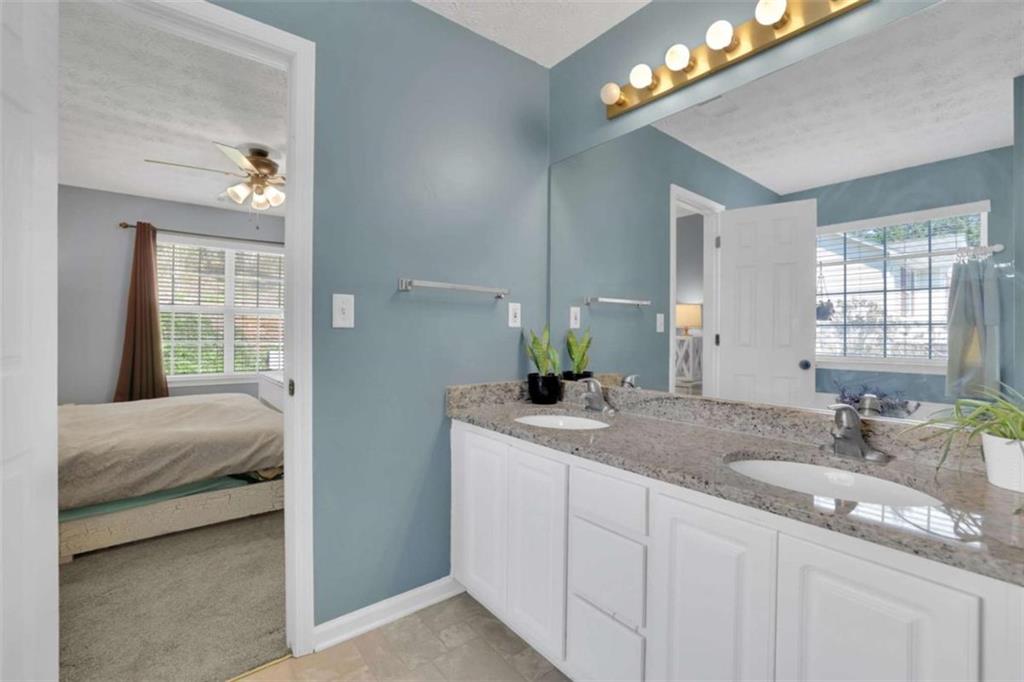 2932 Lake Hollow Road Gainesville, GA 30501 - Photo 36 of 68 a en suite bathroom with double sink and a mirror