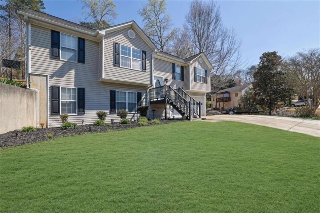 2932 Lake Hollow Road Gainesville, GA 30501 - Photo 4 of 68 a view of a house with a yard