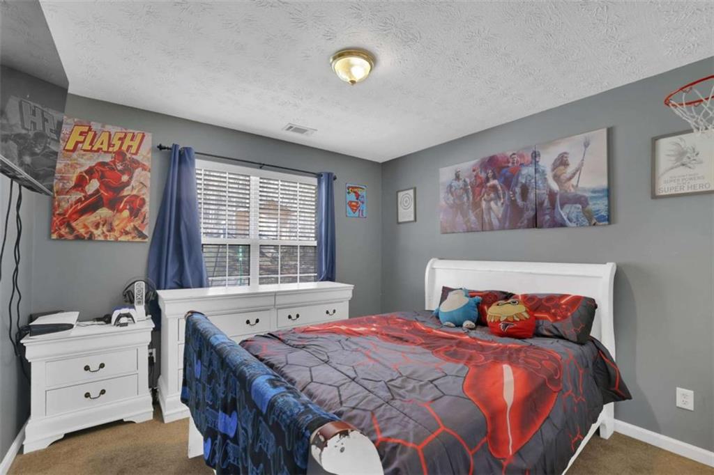 2932 Lake Hollow Road Gainesville, GA 30501 - Photo 41 of 68 a bedroom with a bed and a window