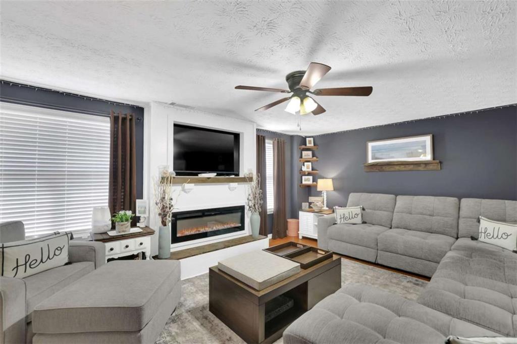 2932 Lake Hollow Road Gainesville, GA 30501 - Photo 42 of 68 a living room with furniture and a flat screen tv