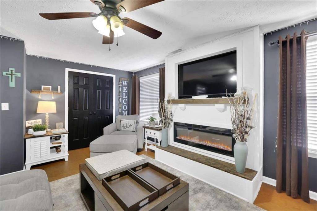 2932 Lake Hollow Road Gainesville, GA 30501 - Photo 45 of 68 a living room with furniture and a flat screen tv