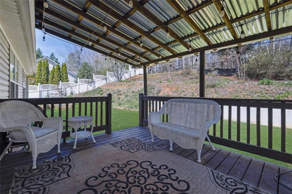 2932 Lake Hollow Road Gainesville, GA 30501 - Photo 57 of 68 a view of a chairs and table in the patio