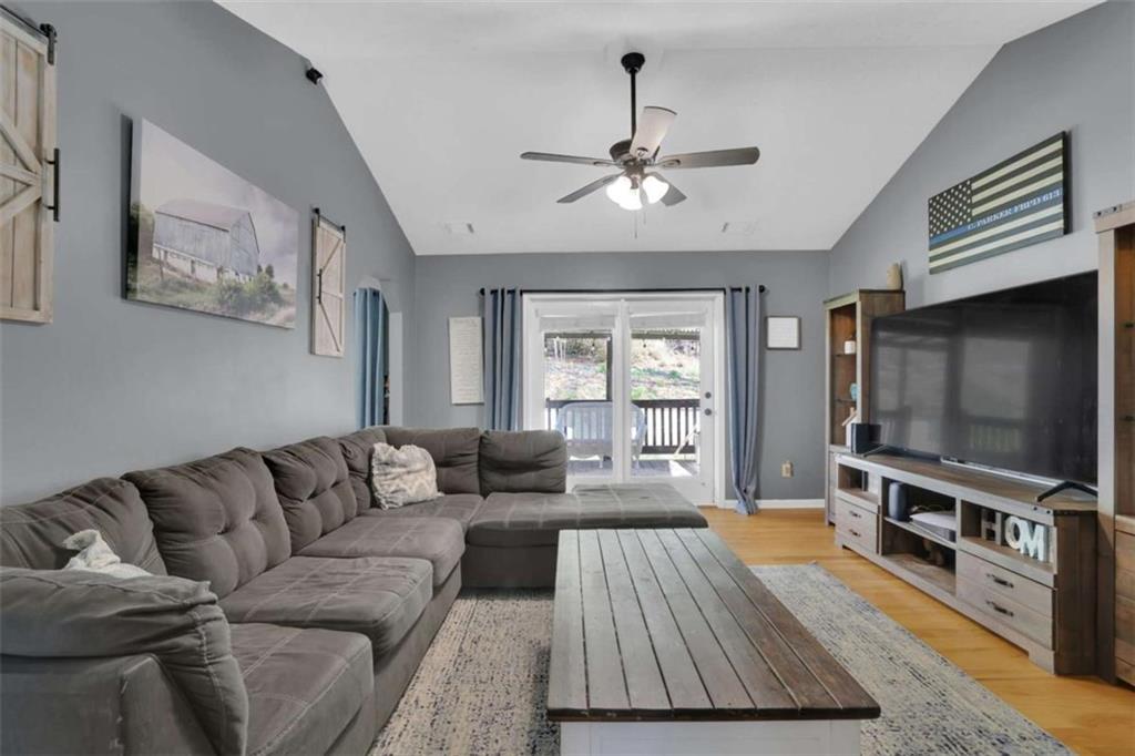 2932 Lake Hollow Road Gainesville, GA 30501 - Photo 7 of 68 a living room with furniture and a flat screen tv
