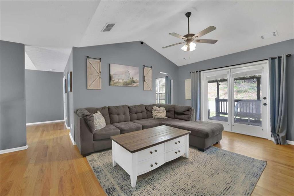 2932 Lake Hollow Road Gainesville, GA 30501 - Photo 9 of 68 a living room with furniture and a chandelier
