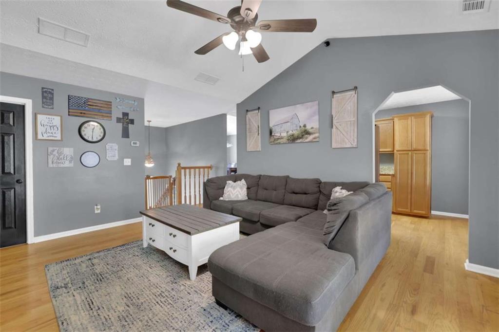2932 Lake Hollow Road Gainesville, GA 30501 - Photo 10 of 68 a living room with furniture and a rug